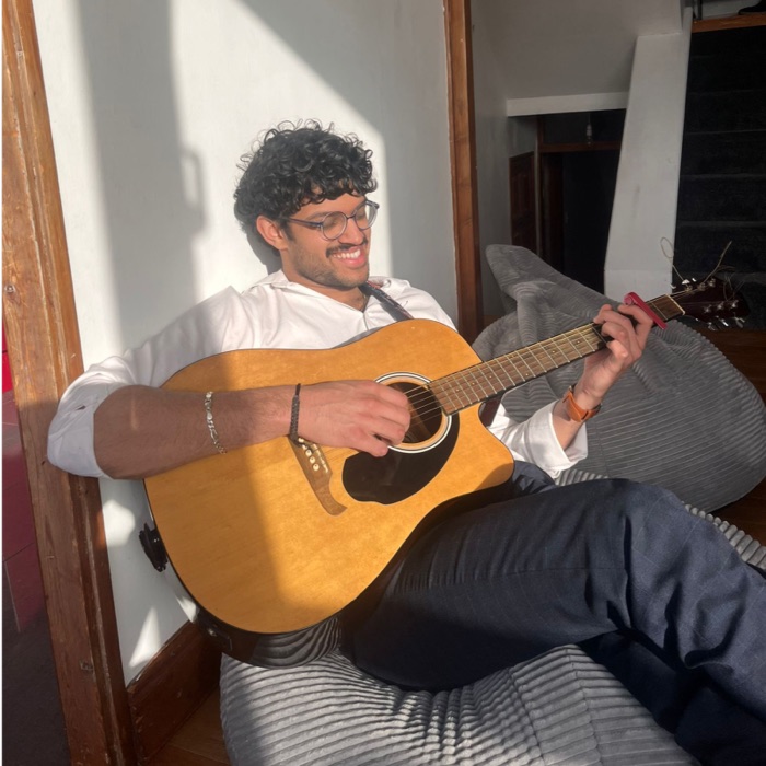 Archit playing guitar